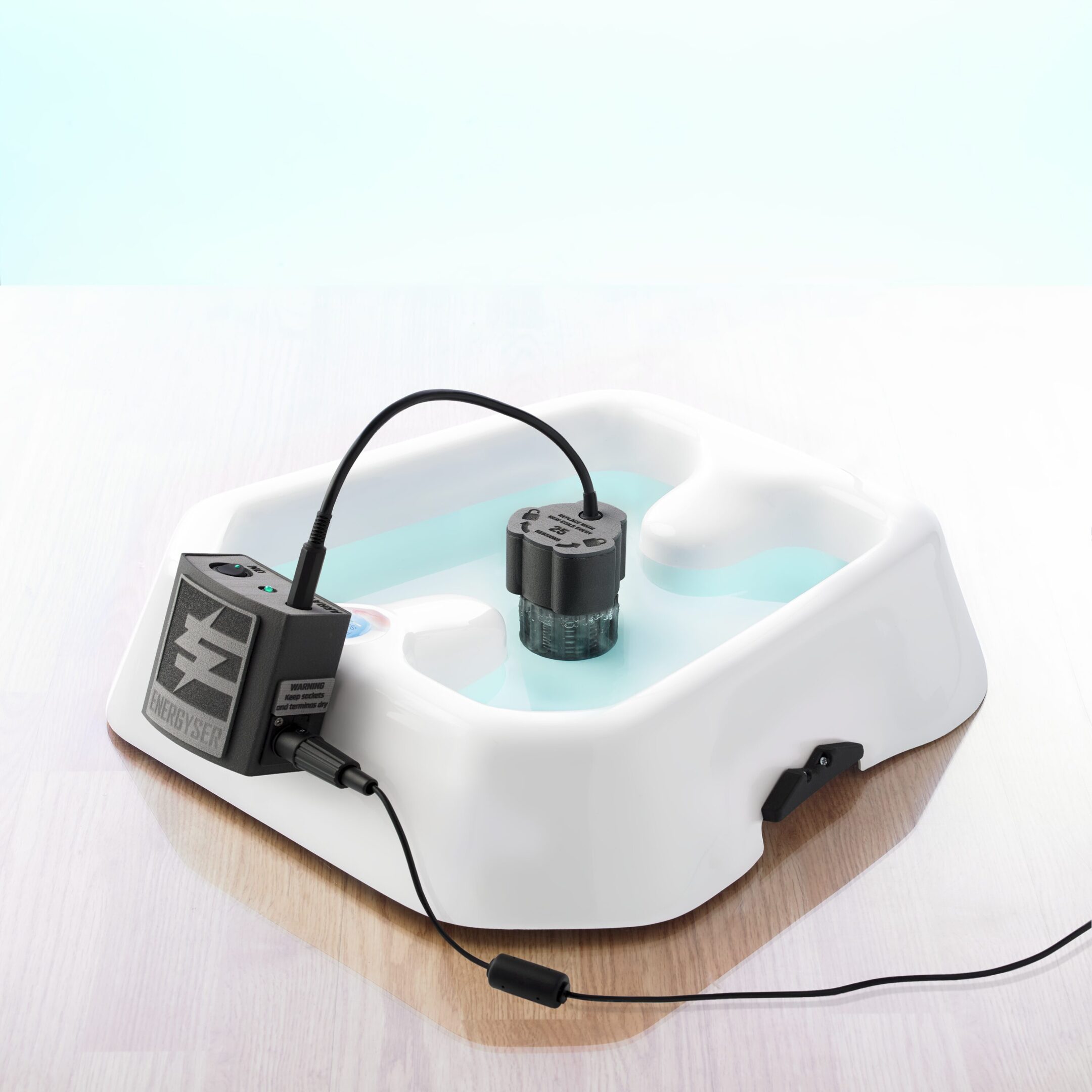 White electric foot spa with attached pump